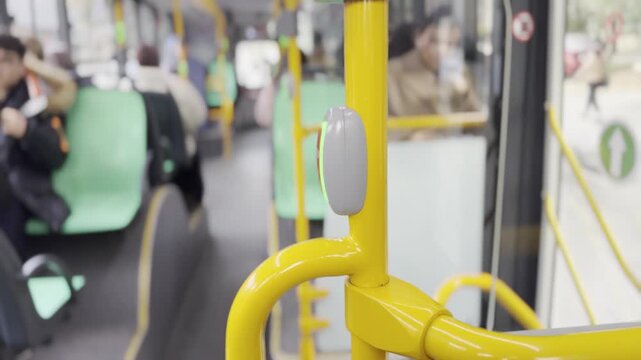 An used red stop button in a bus . Red stop button in public transportation . Stop button in the bus. Urban transportation .