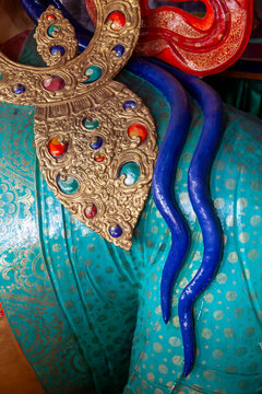 Detail of jeweled ornament and blue hair on a Maitreya Buddha statue at Thiksey monastery, Ladakh, Thiksey, India