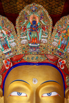 Eyes and jeweled crown of the golden Maitreya Buddha statue at Thiksey monastery, Ladakh, Thiksey, India