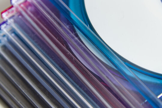 Pile of CD cases of different colors