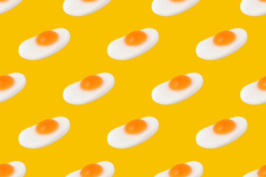 Fried Egg Gummy Candy Seamless Pattern on Yellow Background