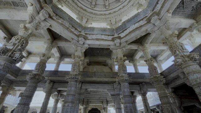 The interior hall with intricately carved marble pillars and ceilings of the Ranakpur Jain Temple in Rajasthan