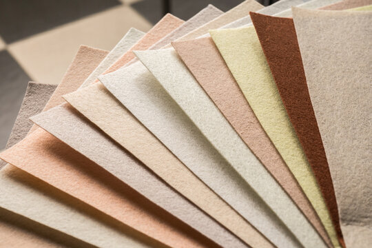 Felt fabric swatches in a fan of warm neutral earth tones