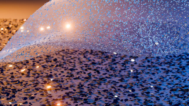 Blue sequined fabric sparkling with glittering texture