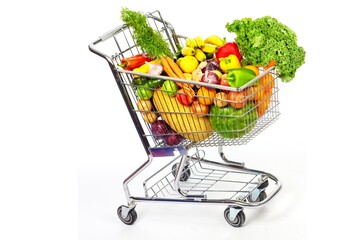 Metal shopping cart filled with fresh fruits and vegetables on white background © Sajida