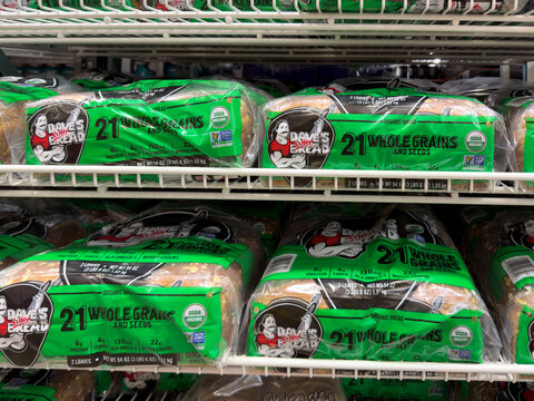 Prosper, Texas, USA - September 21st, 2026: Dave's Killer Bread 21 whole grains and seeds organic bread loaves on shelf in Costco store