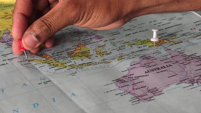 Footage of placing location pins on a map of Indonesia&mdash;specifically at Sabang and Merauke&mdash;marking the territorial boundaries of the country.