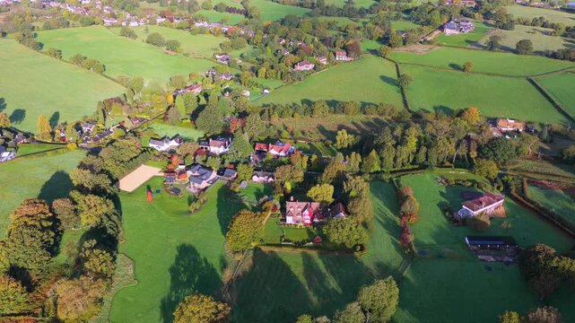 Countryside hamlet with houses and fields near Alderley Edge, Cheshire, aerial