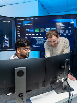 Software engineering use computer working develop AI office are assisting algorithm systems or verifying code. Programmer teamwork using artificial intelligence on laptop analysis or writing coding