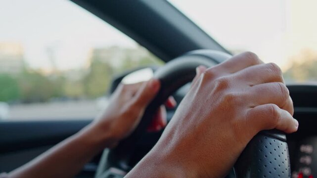 Young woman drives comfortable car through bustling city