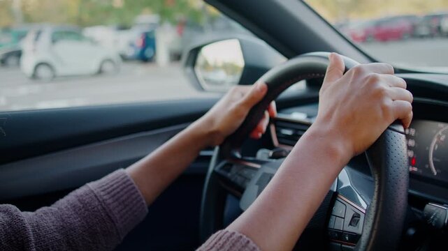 Confident woman navigates contemporary vehicle through city