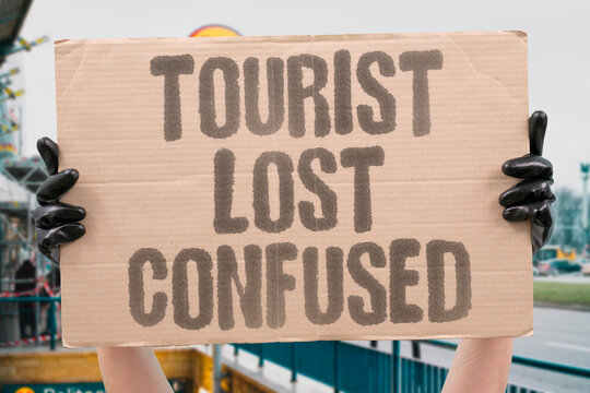 "Tourist lost confused" Visitor wanders unfamiliar streets unable to find hotel. TOURIST. LOST. CONFUSED. STREETS. HOTEL.