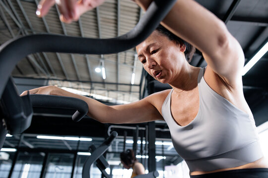 Woman rests on a stationary bike