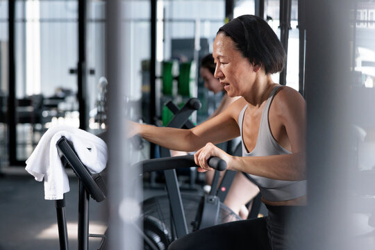 Portrait of an elderly woman working out indoors