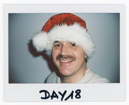 Man With Moustache Wearing Santa Hat in Instant Picture Series