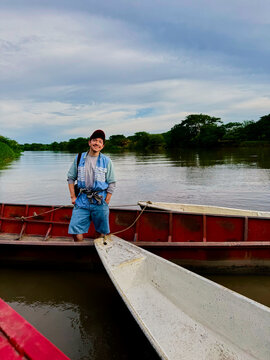 Man Standing on Bow of Boat on Magdalena River