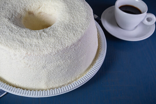 Brazilian bolo de leite ninho - Powdered Milk cake with coffee cup