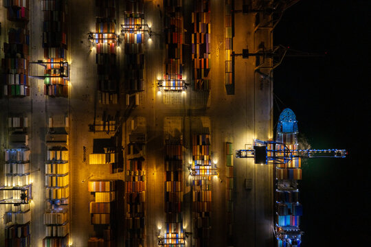 Container ship at port working at night