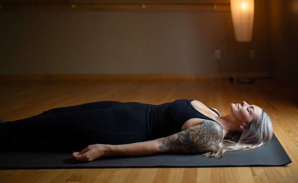 Peaceful meditation in savasana yoga pose