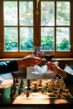 Wine Toast Over Chess