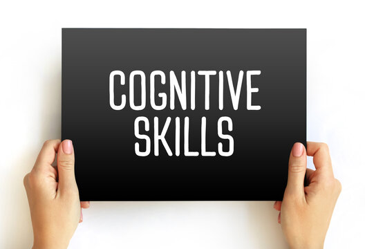 COGNITIVE SKILLS text on a card held by hands. Educational and psychological concept representing learning, intelligence, and brain development for various applications.