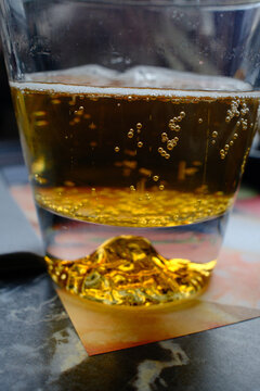 Cold Beer Served in a Glass Mug with Golden Color and Foam