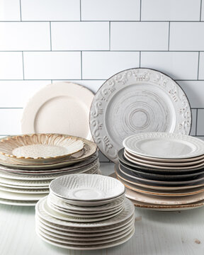 Stacks of plates agains a white background.