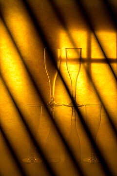 Still life with glass wine glasses and dark stripes