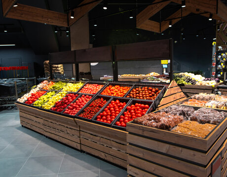 Fresh Organic Fruits and Vegetables on Wooden Display Crates in Modern Supermarket