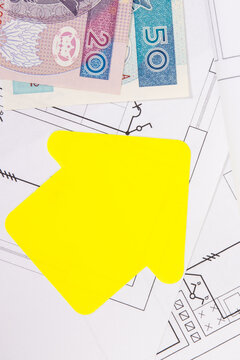 Polish currency banknotes, diagrams of electric installation and shape of house. Planning build or buy of home