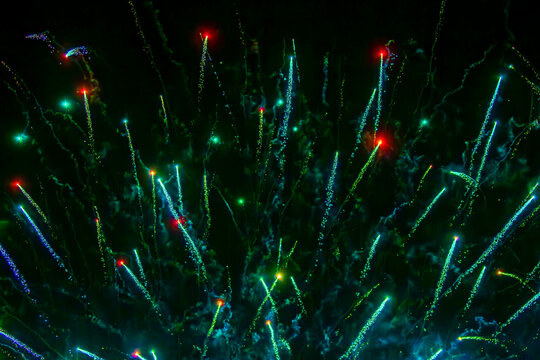 Fireworks close-up. Multicolored fireworks in the night sky, bright festive background with space for text.
