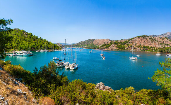 Panoramic viw of Kizkumu beach. Aerial view of boats anchored near the famous red sandbar of Kizkumu beach in Orhaniye, Marmaris, Turkey