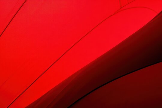 abstract background of flowing red fabric with dark shadows and light highlights creating dynamic curves