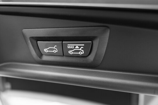 Close up of automatic car trunk closing buttons on a tailgate