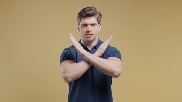 Serious Adult Man Showing Firm Stop Gesture With Both Hands, Rejecting An Offer Or Proposal, Expressing Refusal, Ban, Restriction, Warning