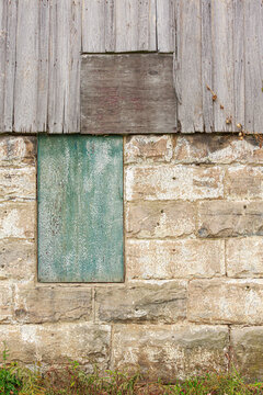 old wooden and brick rustic vintage barn wall with window warm tones