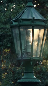 Vertical Close Up Shot Of Vintage Street Lamp In Park