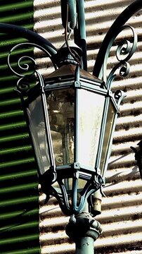 Vintage Street Lantern On Corrugated Metal Wall In Caminito La Boca - 4K Vertical
