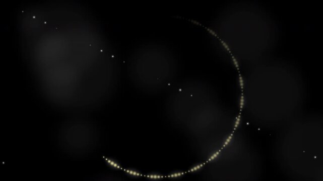 Glitter Sparkle Particle Trail Glowing in a Circular Spiral Motion with Shimmering Stardust Bokeh on Black Background