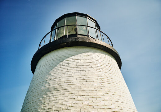Owls Head Light, a historic cylindrical brick lighthouse perched on Penobscot Bay in Owls Head, Maine, New England