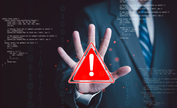 Cybersecurity warning with a red alert symbol, business professional, computer code, and binary data, illustrating software vulnerabilities, digital threats, and data protection.