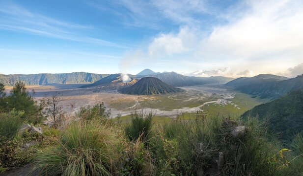 View of volcanic landscape, volcanoes, smoking volcano Gunung Bromo, Mt. Batok, Mt. Kursi, Mt. Gunung Semeru, Bromo-Tengger-Semeru National Park, Java, Indonesia