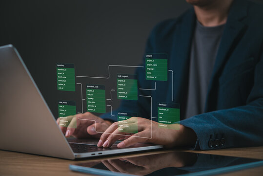 Software developer typing on laptop with database code repository, AI assistant and project workflow interface.