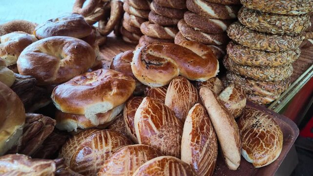 Market stall displaying loaves and round breads for sale