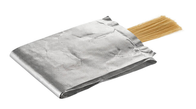 Unopened package of uncooked spaghetti on a transparent background