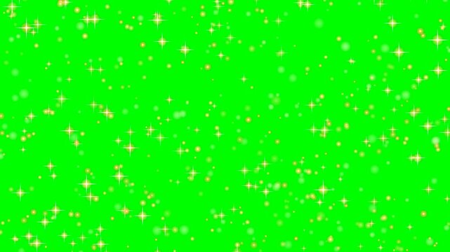 Magical golden glitter, sparkling star particles, and soft glowing bokeh falling smoothly against chroma green screen, 4K 60fps 8s seamless loop.
