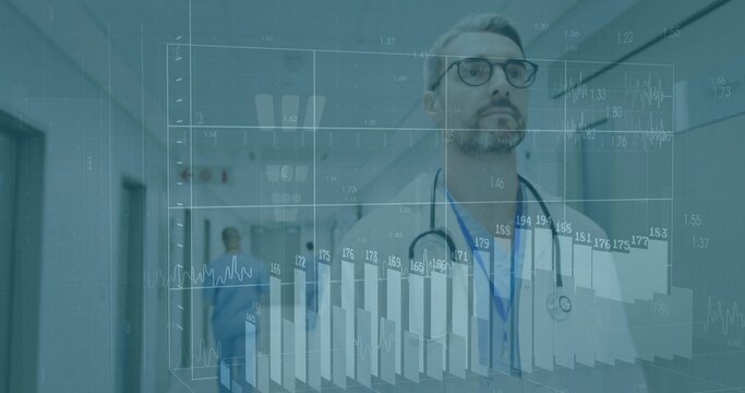 Viewing bearded physician in lab coat and glasses studying 3D charts in medical hallway