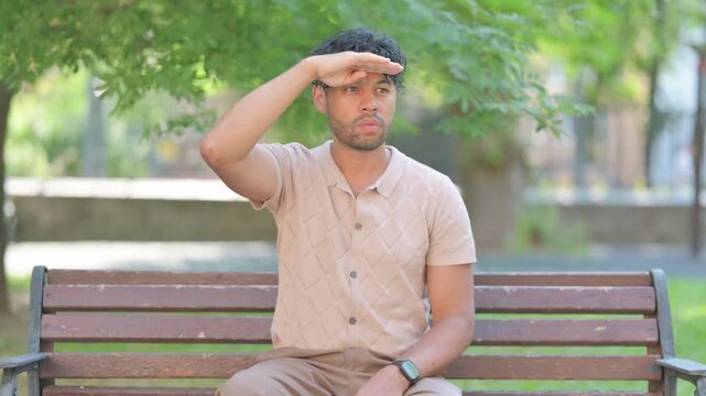 Searching Mixed Race Man Looking Around Outdoor
