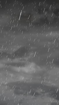 Vertical video: Storm sky sending lightning from charge, slanting rain lighting cloud textures