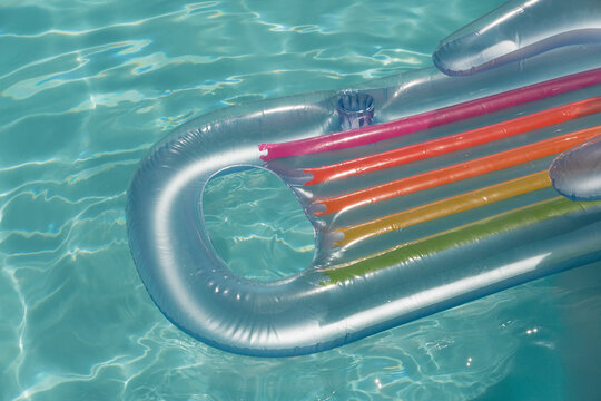 Inflatable tube floating in a swimming pool